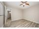 Spacious bedroom featuring a ceiling fan and wood-style flooring for a modern feel at 4403 Sunburst Ct, Raleigh, NC 27613
