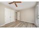 The bedroom features neutral walls, double closets, and vinyl flooring at 4403 Sunburst Ct, Raleigh, NC 27613