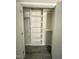 Walk-in closet featuring custom built-in shelves and a sturdy hanging rod at 4403 Sunburst Ct, Raleigh, NC 27613