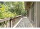A beautiful wooden deck with railings offers outdoor enjoyment and views of surrounding trees at 4403 Sunburst Ct, Raleigh, NC 27613