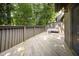 Spacious wooden deck offers outdoor seating area with a cozy bench for relaxation at 4403 Sunburst Ct, Raleigh, NC 27613