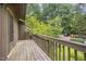 Exterior shot of a wooden deck, perfect for entertaining and enjoying nature views at 4403 Sunburst Ct, Raleigh, NC 27613