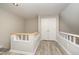 Hallway area boasting wood floors and white and natural wood railing at 4403 Sunburst Ct, Raleigh, NC 27613