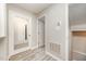 Bright hallway with wood-look floors, neutral walls, and doorways at 4403 Sunburst Ct, Raleigh, NC 27613