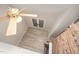 Vaulted ceiling living room with ceiling fan, brick fireplace and view to outside through double doors at 4403 Sunburst Ct, Raleigh, NC 27613