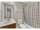 Bathroom with vanity, toilet, and tub with shower and decorative shower curtain for added privacy at 500 Chandler Grant Dr, Cary, NC 27519