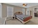 Bedroom featuring a bed with a patterned comforter, natural lighting, and neutral-toned walls at 500 Chandler Grant Dr, Cary, NC 27519