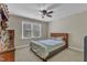 A comfortable bedroom with a ceiling fan and large window offers a bright and airy atmosphere at 500 Chandler Grant Dr, Cary, NC 27519