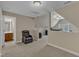 Upstairs bonus room area with space for gaming, relaxing and entertaining near the bathroom at 500 Chandler Grant Dr, Cary, NC 27519