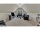 Bonus room features a vaulted ceiling, carpeted floors, and a comfortable sitting area for relaxing and entertaining at 500 Chandler Grant Dr, Cary, NC 27519