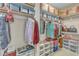A spacious walk-in closet provides ample storage with shelves and hanging rods for organized living at 500 Chandler Grant Dr, Cary, NC 27519
