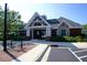 This community clubhouse offers a welcoming brick exterior and beautifully landscaped grounds at 500 Chandler Grant Dr, Cary, NC 27519