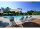 A community pool and lounge chairs offers residents relaxation under the bright sunshine at 500 Chandler Grant Dr, Cary, NC 27519
