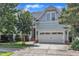 Charming home featuring an attached two-car garage and beautiful landscaping at 500 Chandler Grant Dr, Cary, NC 27519