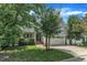 Traditional home with a charming two-car garage and mature landscaping at 500 Chandler Grant Dr, Cary, NC 27519