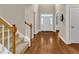 Welcoming home entry featuring hardwood floors and a staircase at 500 Chandler Grant Dr, Cary, NC 27519