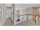 Second floor hallway featuring views of the downstairs living room with a fireplace and plenty of natural light at 500 Chandler Grant Dr, Cary, NC 27519