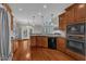 Spacious kitchen with wood cabinets, granite countertops, stainless appliances, and breakfast bar at 500 Chandler Grant Dr, Cary, NC 27519
