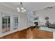 Open living area with fireplace, cathedral ceilings, hardwood floors, and access to deck at 500 Chandler Grant Dr, Cary, NC 27519