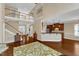 Open-concept living area featuring wood floors and a staircase to the second floor at 500 Chandler Grant Dr, Cary, NC 27519