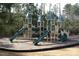 Community playground with multiple slides and climbing structures for hours of outdoor fun at 500 Chandler Grant Dr, Cary, NC 27519
