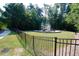 Community playground features slides and climbing structures, all enclosed within a secure fenced area at 500 Chandler Grant Dr, Cary, NC 27519