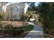 Scenic walkway leading to a charming home with a well-maintained landscape at 500 Chandler Grant Dr, Cary, NC 27519