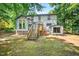 The backyard features a wooden deck and staircase at 508 Bolin Creek Dr, Carrboro, NC 27510