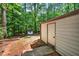 View of the backyard showing shed and trees at 508 Bolin Creek Dr, Carrboro, NC 27510