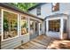 Backyard featuring a spacious wooden deck and light grey siding on the home's exterior at 508 Bolin Creek Dr, Carrboro, NC 27510