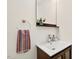 Bathroom with single vanity, mirror, and towel hook at 508 Bolin Creek Dr, Carrboro, NC 27510