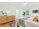 Bright bedroom featuring hardwood floors, a decorative rug, and stylish modern furniture at 508 Bolin Creek Dr, Carrboro, NC 27510