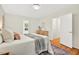 Well-lit bedroom features hardwood floors, a decorative rug, and stylish modern furniture at 508 Bolin Creek Dr, Carrboro, NC 27510