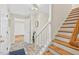 Entryway with tile and wood floors, staircase, and view to adjacent room at 508 Bolin Creek Dr, Carrboro, NC 27510