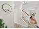 Bright entryway boasts tiled floors, a staircase with wooden steps, and a glimpse of the living area at 508 Bolin Creek Dr, Carrboro, NC 27510
