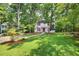 Charming two-story home with a well-manicured lawn and mature trees at 508 Bolin Creek Dr, Carrboro, NC 27510