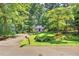 Charming two-story home with a well-manicured lawn and mature trees at 508 Bolin Creek Dr, Carrboro, NC 27510