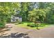 Charming two-story home with a well-manicured lawn and mature trees at 508 Bolin Creek Dr, Carrboro, NC 27510