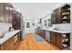 Bright, updated kitchen with stainless steel appliances, white countertops, and dark cabinetry at 508 Bolin Creek Dr, Carrboro, NC 27510