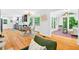 Open-concept space with a sunroom, dining area, and kitchen featuring hardwood floors at 508 Bolin Creek Dr, Carrboro, NC 27510