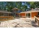 Expansive wooden deck perfect for outdoor gatherings and relaxation surrounded by lush trees at 5257 Vann St, Raleigh, NC 27606