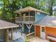 Charming two-story home with a spacious back deck, upper balcony, and an additional outbuilding at 5257 Vann St, Raleigh, NC 27606