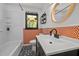 Charming bathroom with decorative tile, modern fixtures and a window at 5257 Vann St, Raleigh, NC 27606