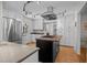 Spacious kitchen with stainless steel appliances, an island cooktop, and ample storage at 5257 Vann St, Raleigh, NC 27606