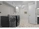 Well-lit laundry room with new appliances and ample storage at 5257 Vann St, Raleigh, NC 27606
