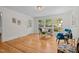 Bright living room with hardwood floors, large windows, and stylish decor at 5257 Vann St, Raleigh, NC 27606