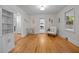 Bright living room with hardwood floors, white trim and built-in shelving at 5257 Vann St, Raleigh, NC 27606