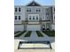 Charming townhome with attached garages, stone accents, and modern design in a friendly community at 5324 River Reach Dr, Raleigh, NC 27616