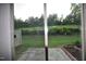 Enjoy outdoor views with mature landscaping from the living space through sliding glass doors and windows at 536 Rockcastle Dr, Cary, NC 27519
