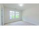 Bright bedroom with neutral carpet and window offers relaxing natural light and neighborhood view at 536 Rockcastle Dr, Cary, NC 27519